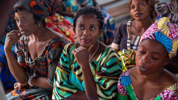 Three woman listen attentively 