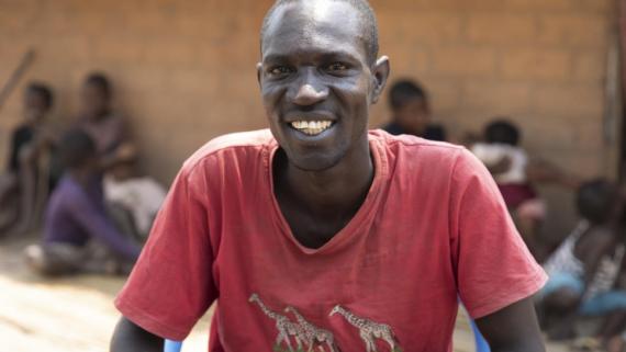 A young men smiles for a picture