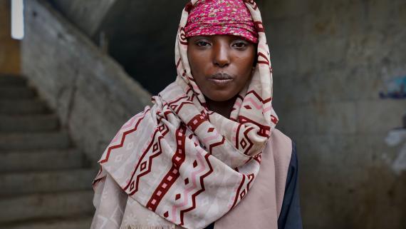 A young girl looks at the camera