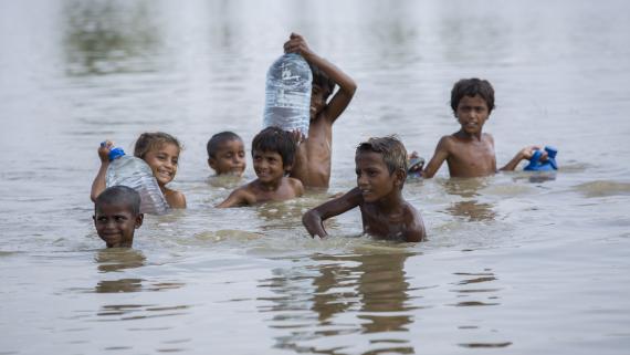 Children in the water play with each other